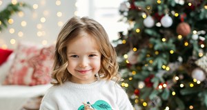 A young girl with a Christmas present